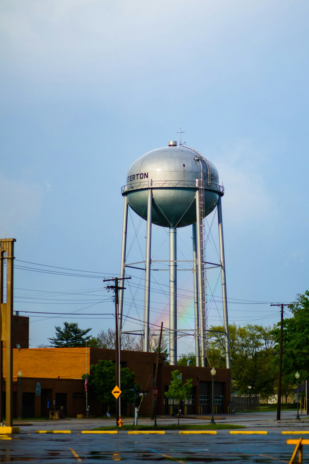 gray water tank on brown wooden dock under white clouds during daytime