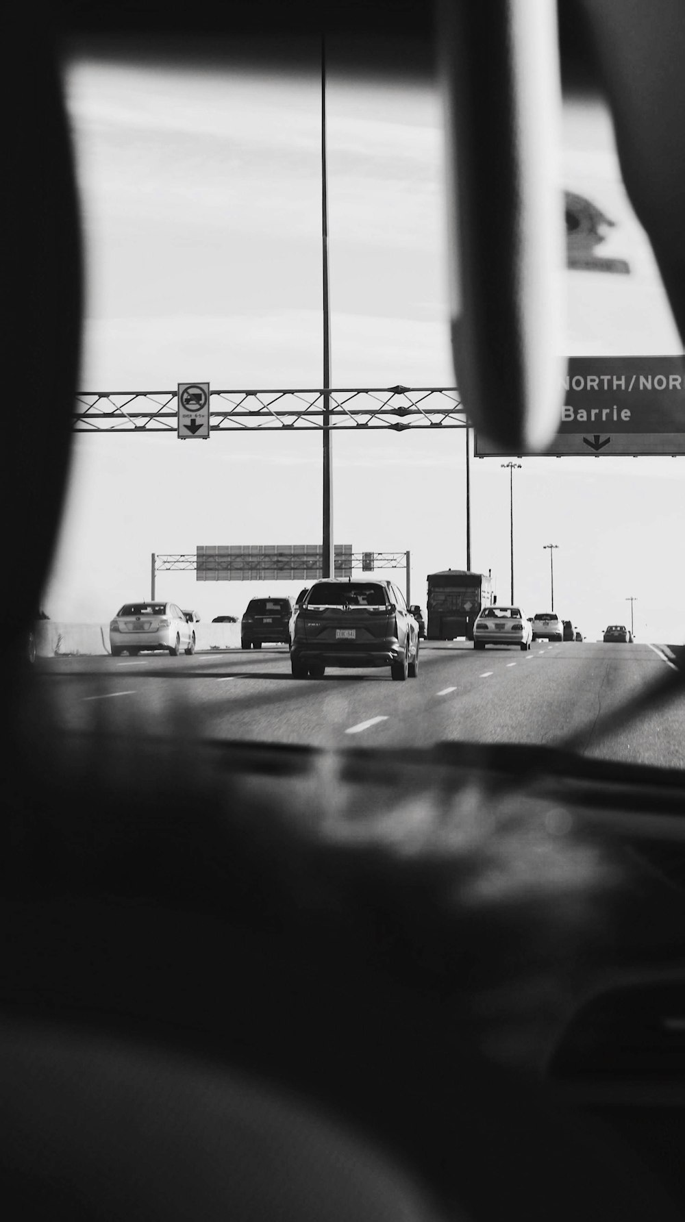 grayscale photo of cars on road