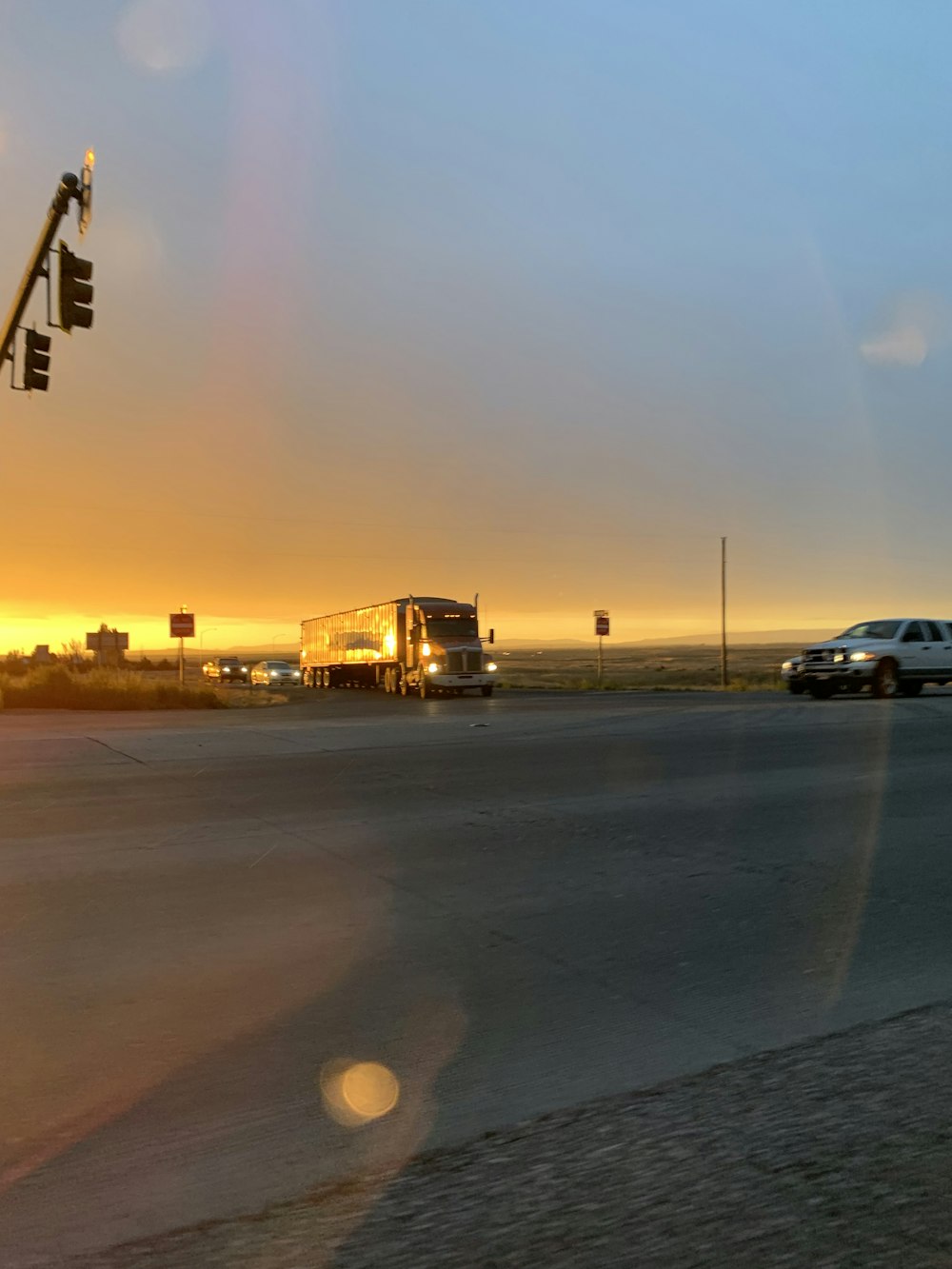 cars on road during sunset