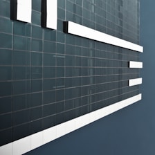 A dark-themed, minimalist wallpaper gallery homepage with a responsive masonry grid.