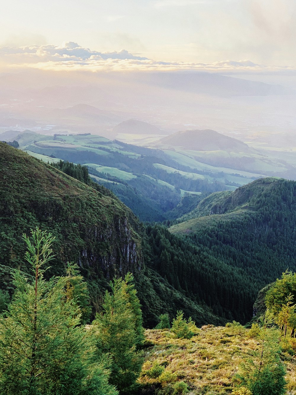 green mountains under white clouds during daytime