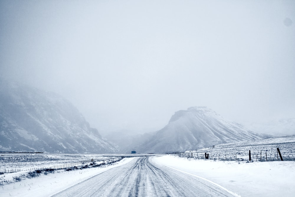 snow covered road during daytime