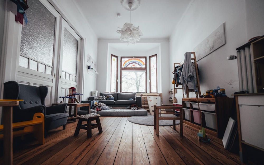 black leather couch beside brown wooden table