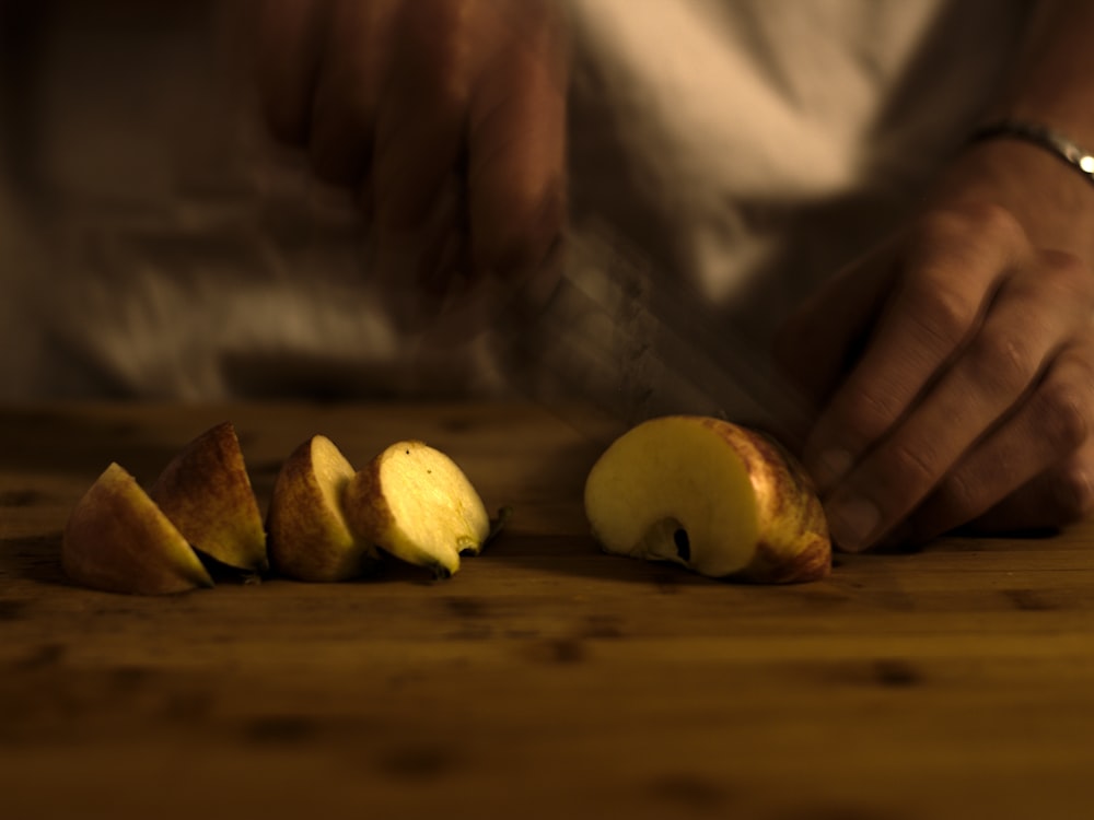 sliced apple on brown wooden table