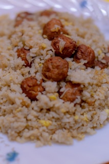 A close-up of crispy fried meatballs on a plate.