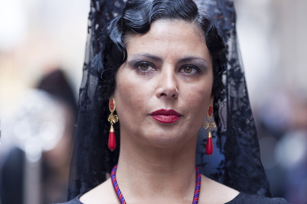 woman in black and white floral head dress