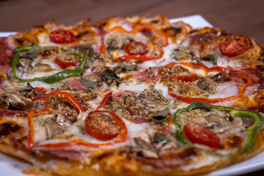 pizza with green leaves and red sauce