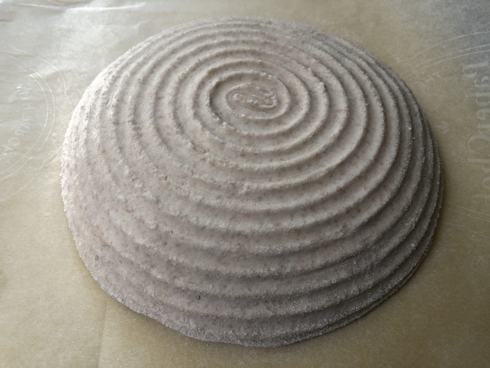 brown round textile on white textile