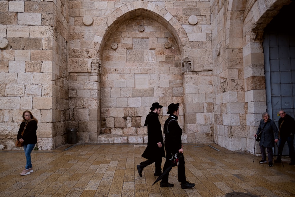 man and woman walking on hallway