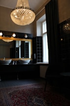 white ceramic sink near window