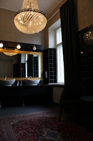 white ceramic sink near window