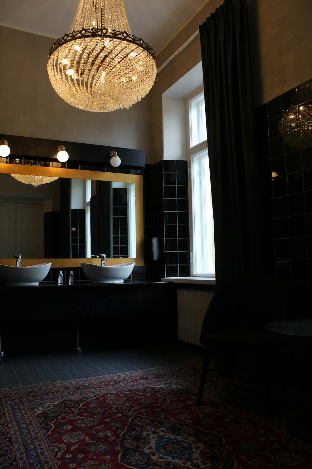 white ceramic sink near window