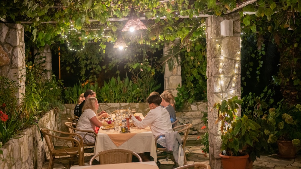 people sitting on chairs in front of table