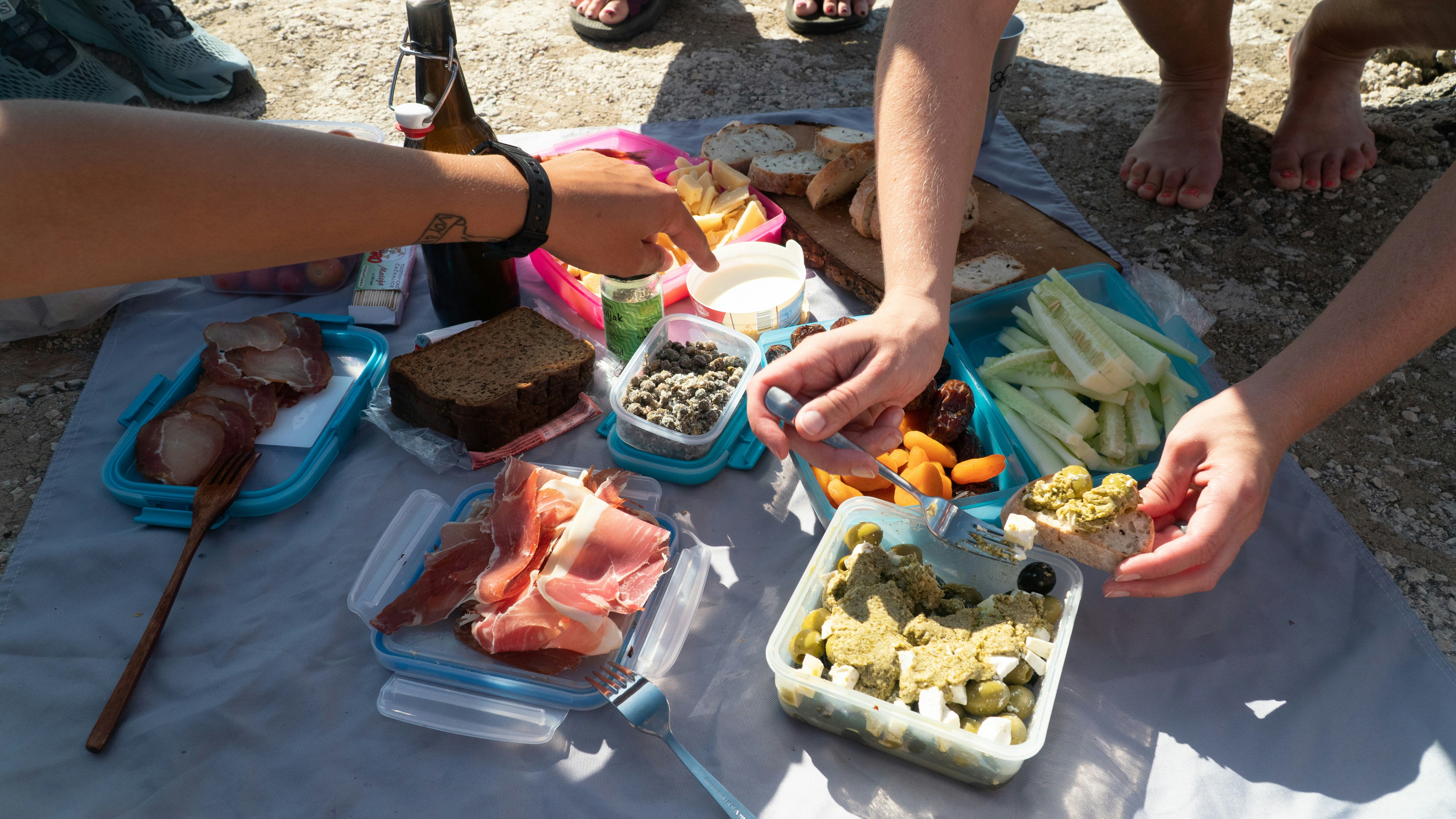 person holding blue and white plastic container