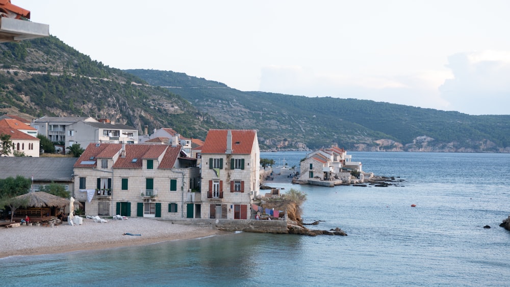 houses near body of water during daytime