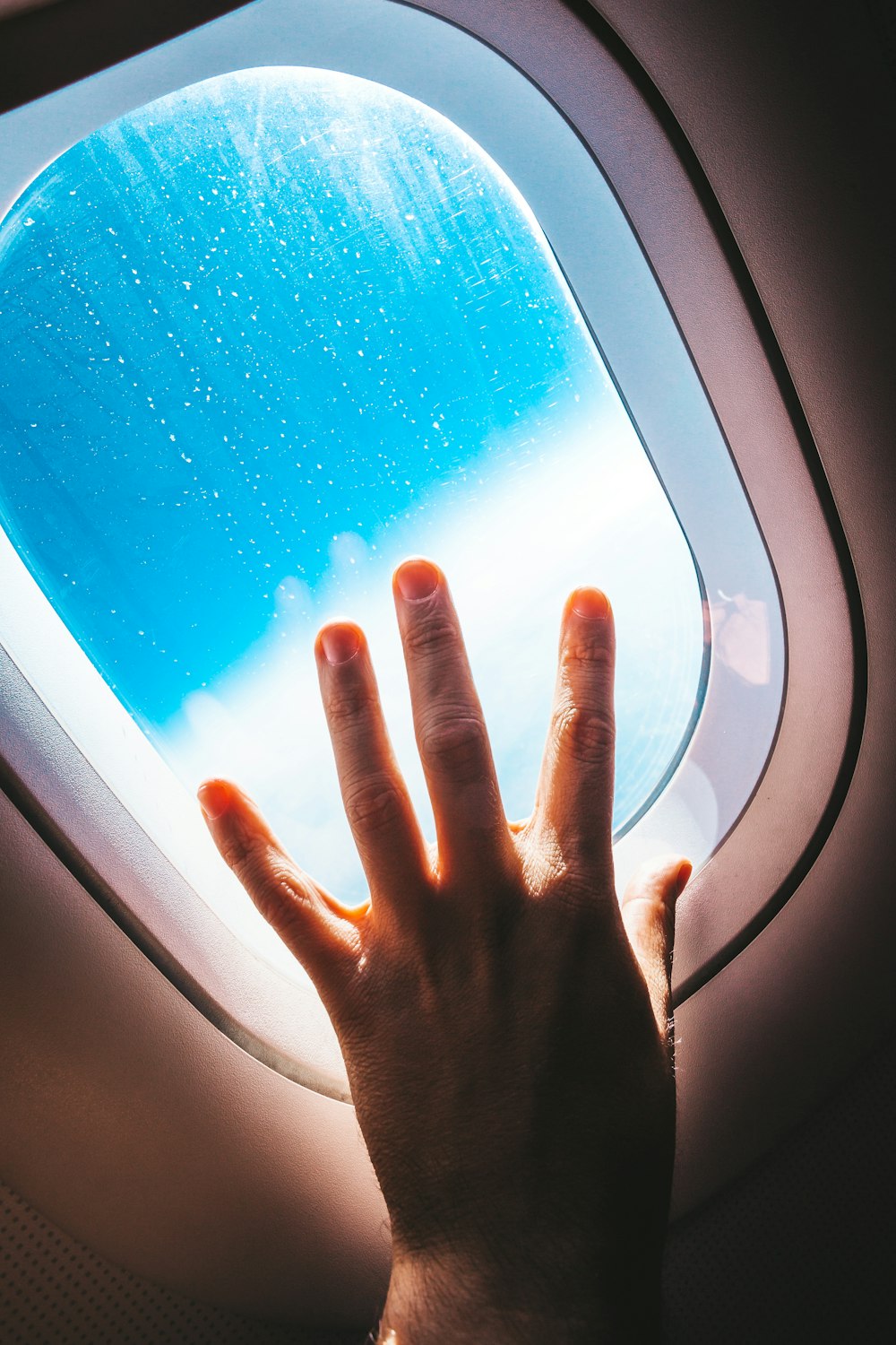 persons hand on car window