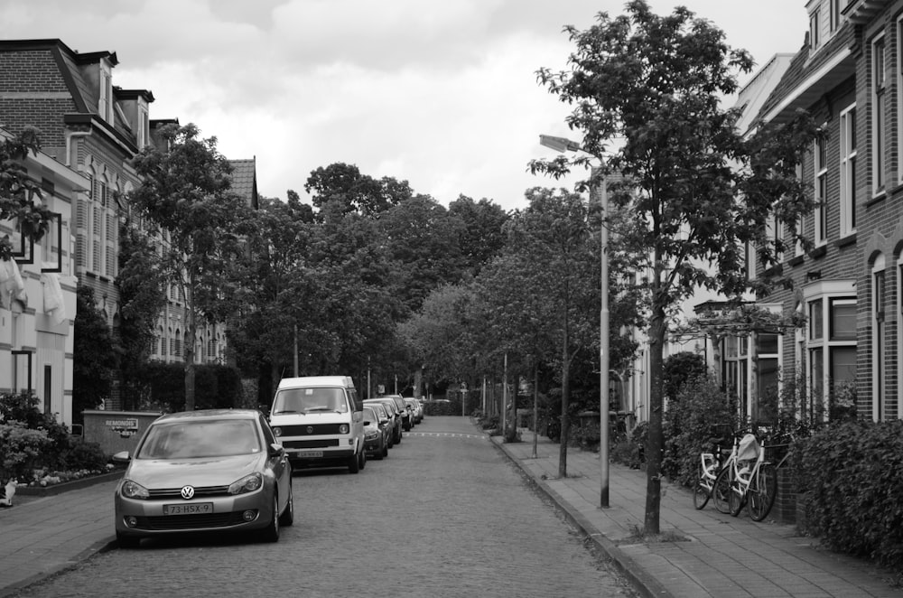 grayscale photo of cars on road