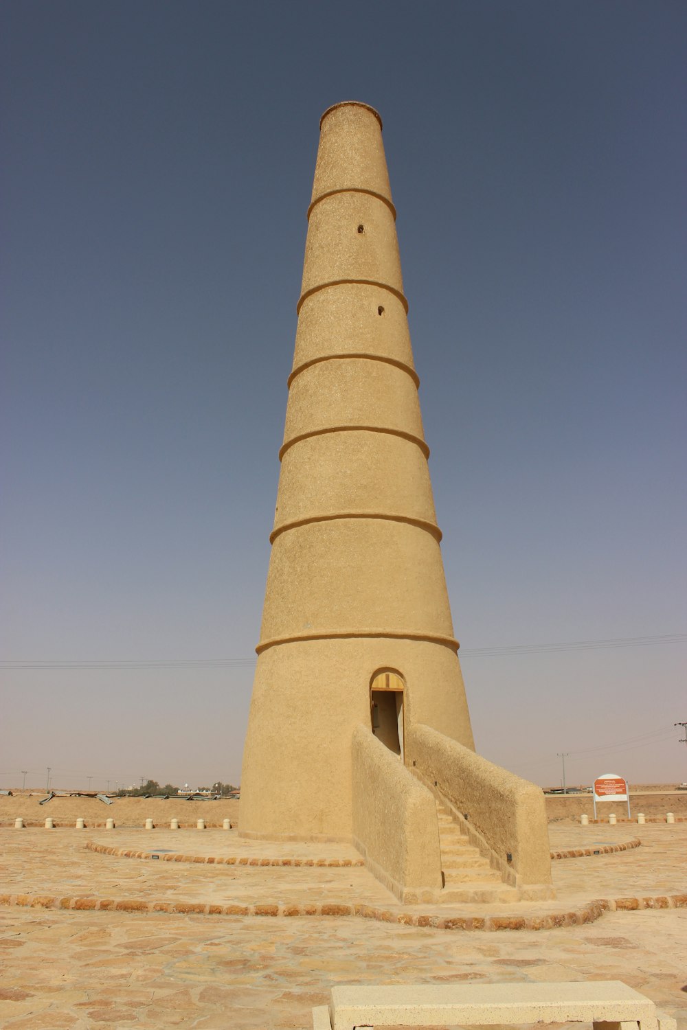 brown concrete tower under blue sky during daytime