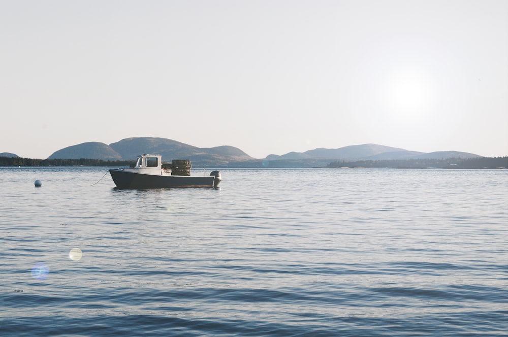 brown boat on sea during daytime