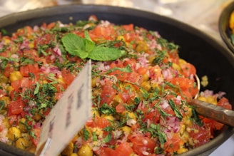 A vibrant salad of diced cucumbers, tomatoes, and mint dressed with lemon juice and olive oil.
