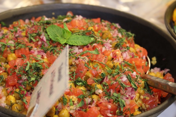 A vibrant salad of diced cucumbers, tomatoes, and mint dressed with lemon juice and olive oil.