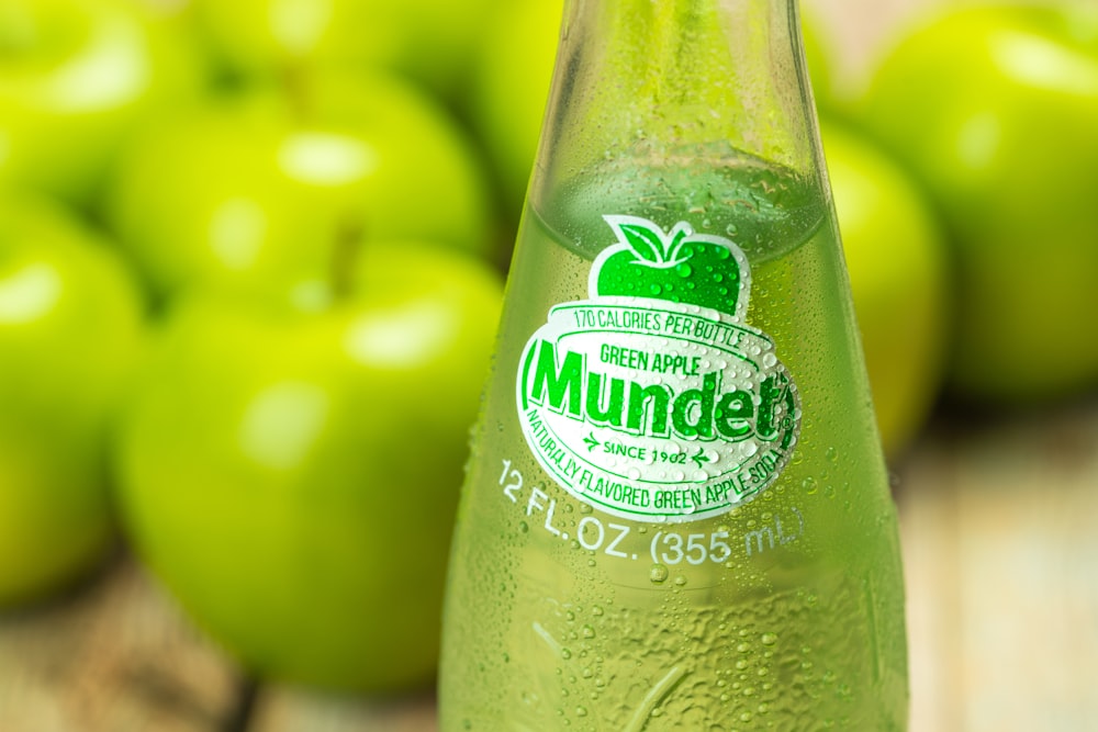 green apple fruit on coca cola bottle