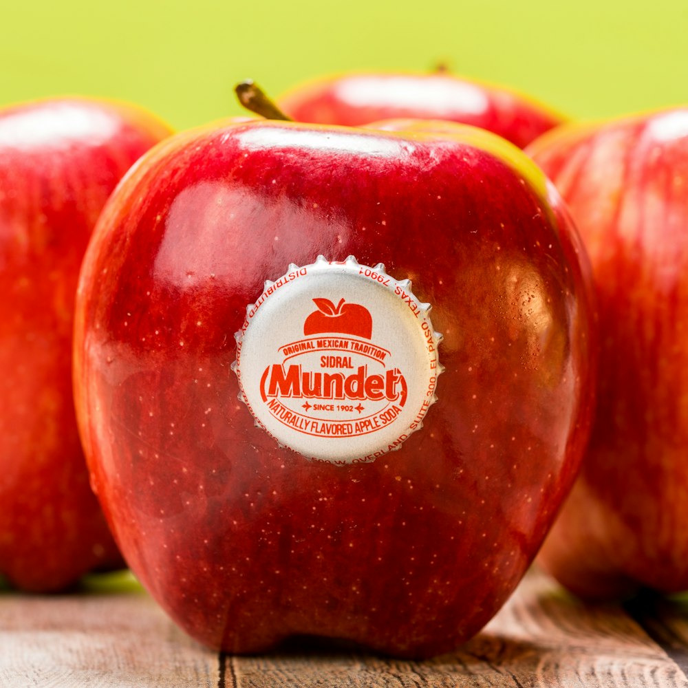 red apple fruit on brown wooden table