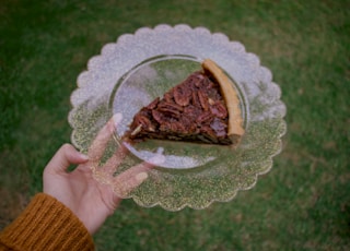 brown cake on clear glass plate