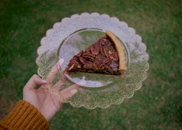 Brown cake on clear glass plate