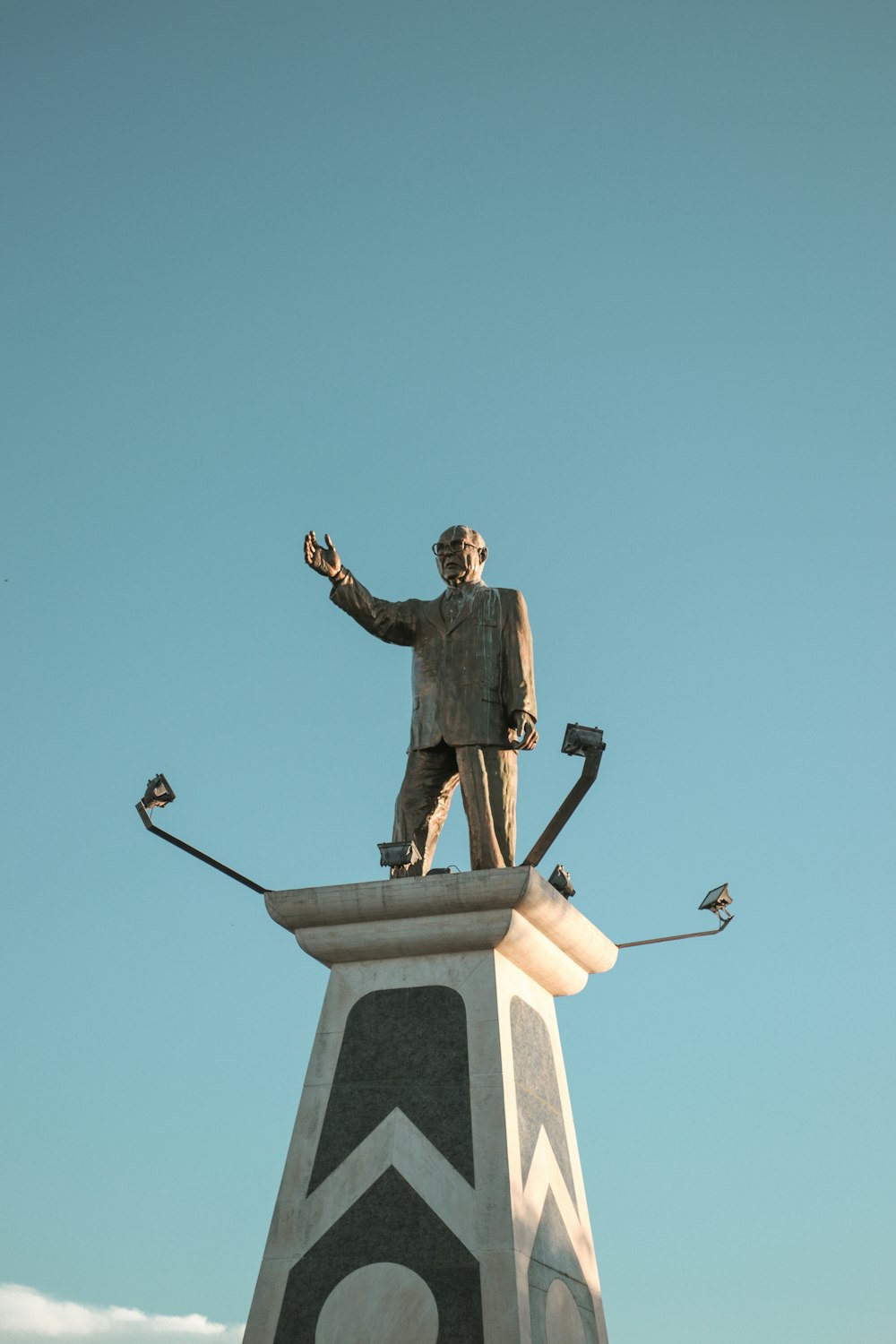 man in black suit statue