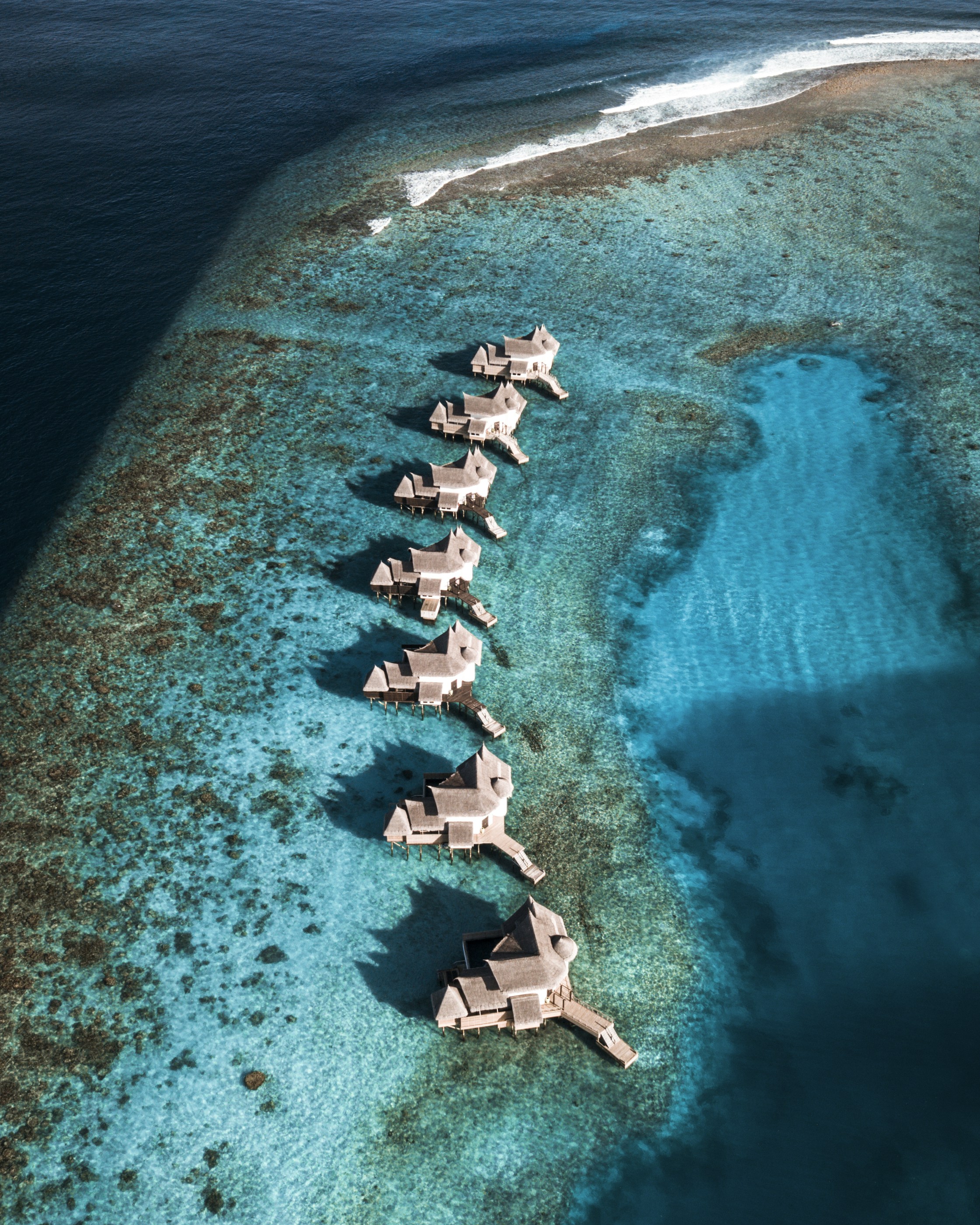 Aerial View Of White And Gray Beach Lounge Chairs On Beach During Daytime Photo Free Image On Unsplash