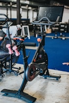 black and blue trike on gray concrete floor