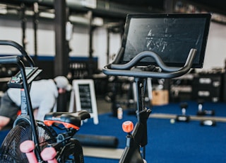 black and blue trike on gray concrete floor