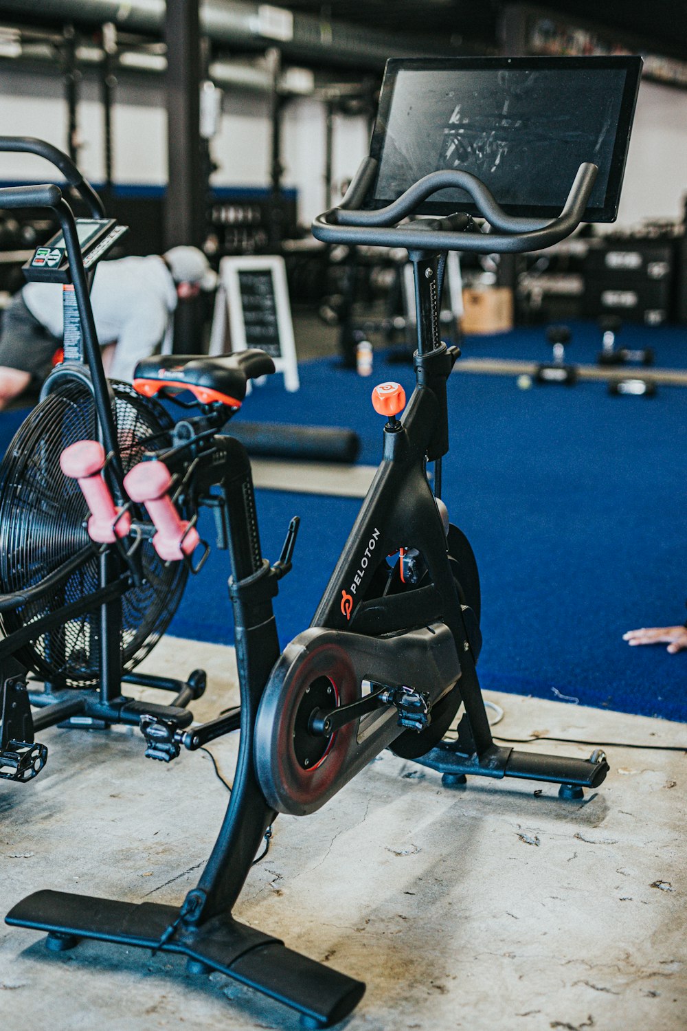 black and blue trike on gray concrete floor