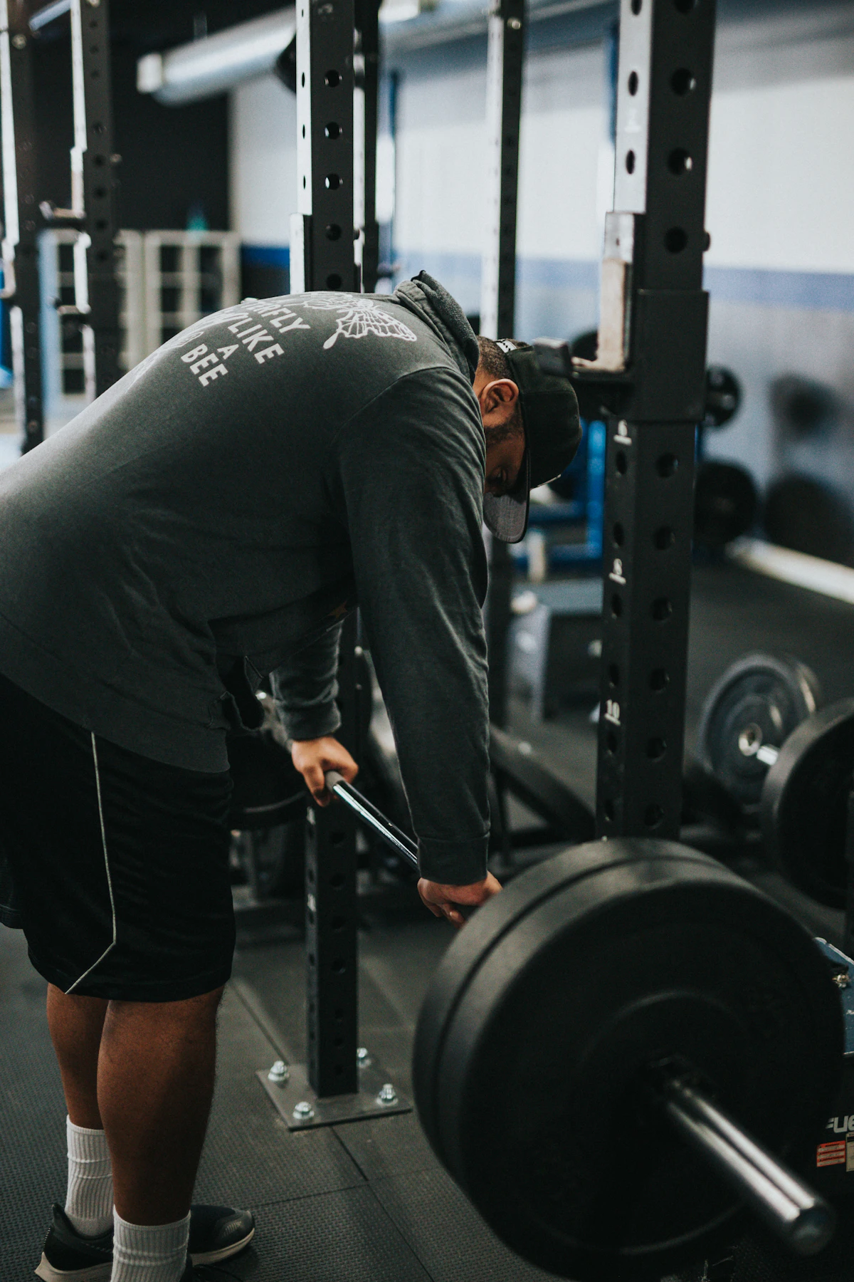 Coach guiding an athlete through a lift