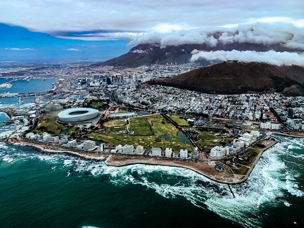 aerial view of city near body of water during daytime