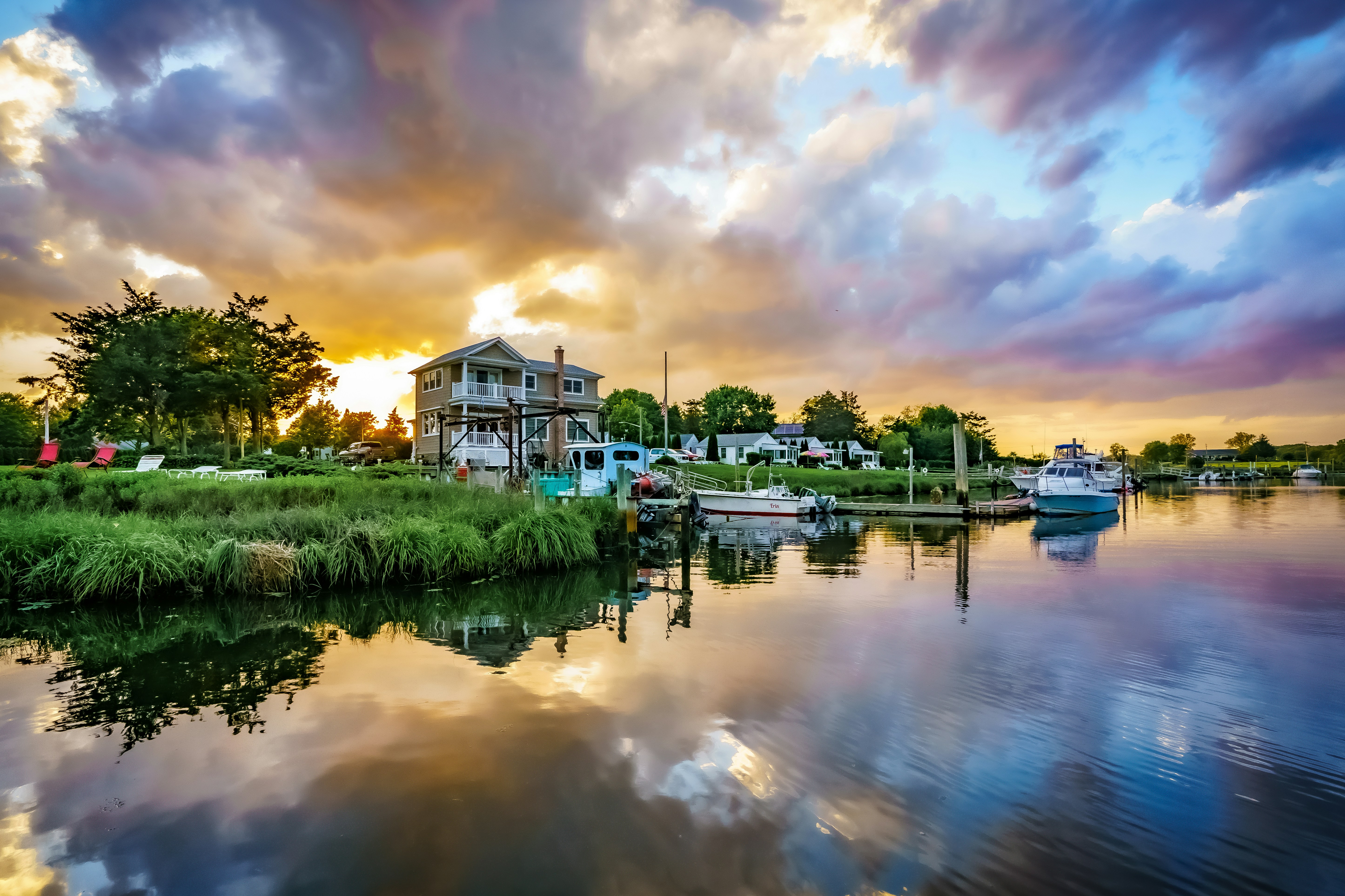 white and brown concrete building near body of water during daytime