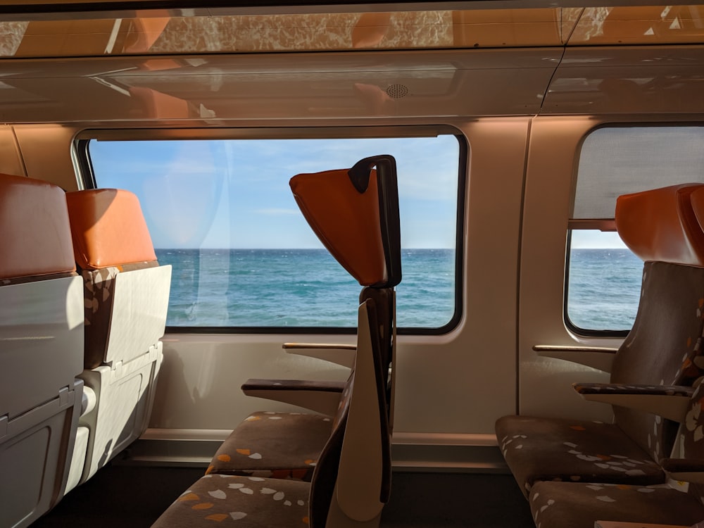 brown and white boat on sea during daytime