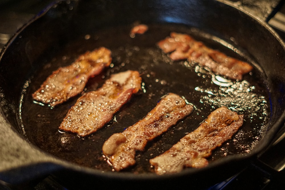 fried meat on black pan