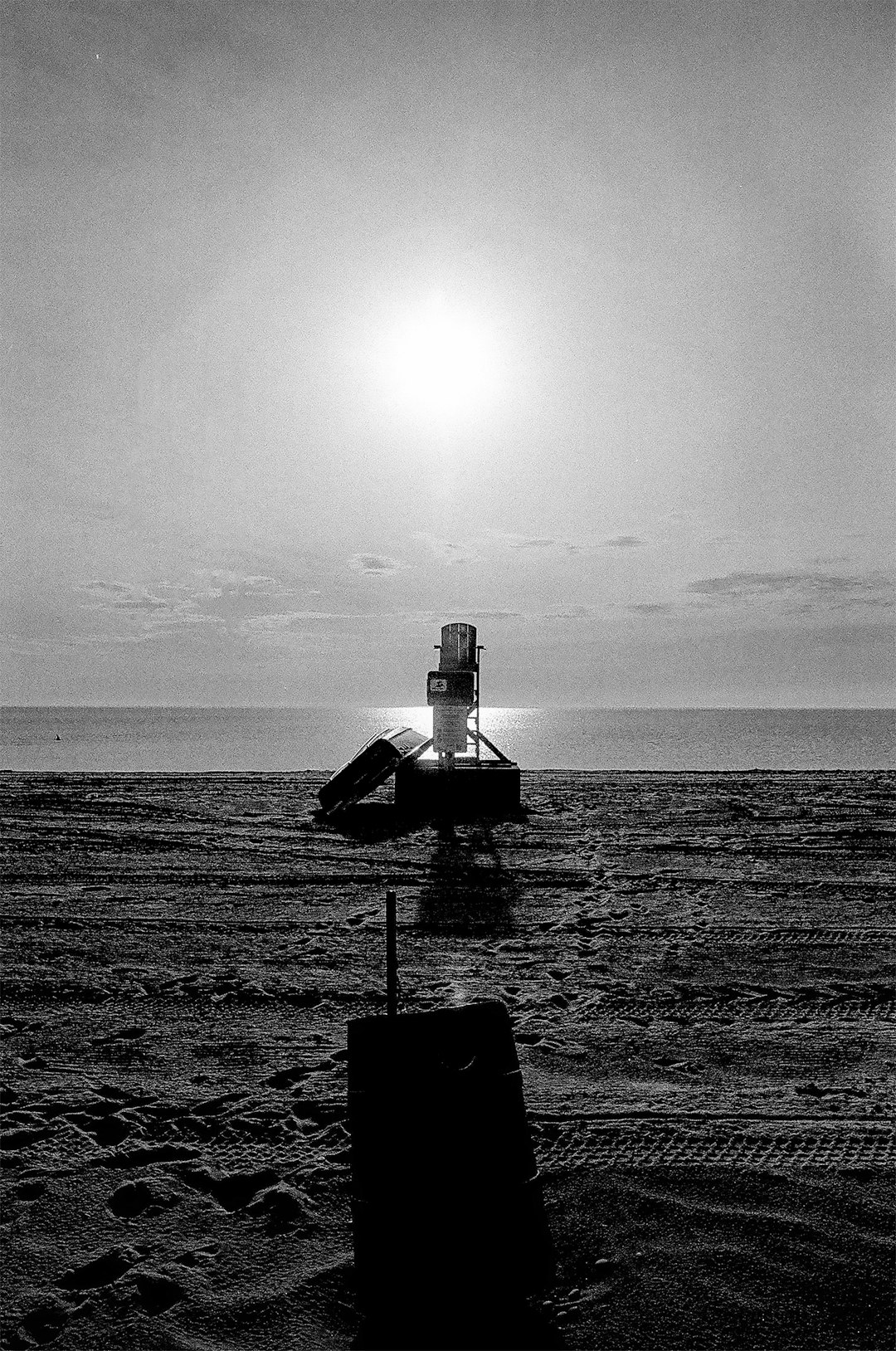 grayscale photo of house on beach