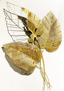 Artistic wooden wall décor featuring natural textures and golden highlights.