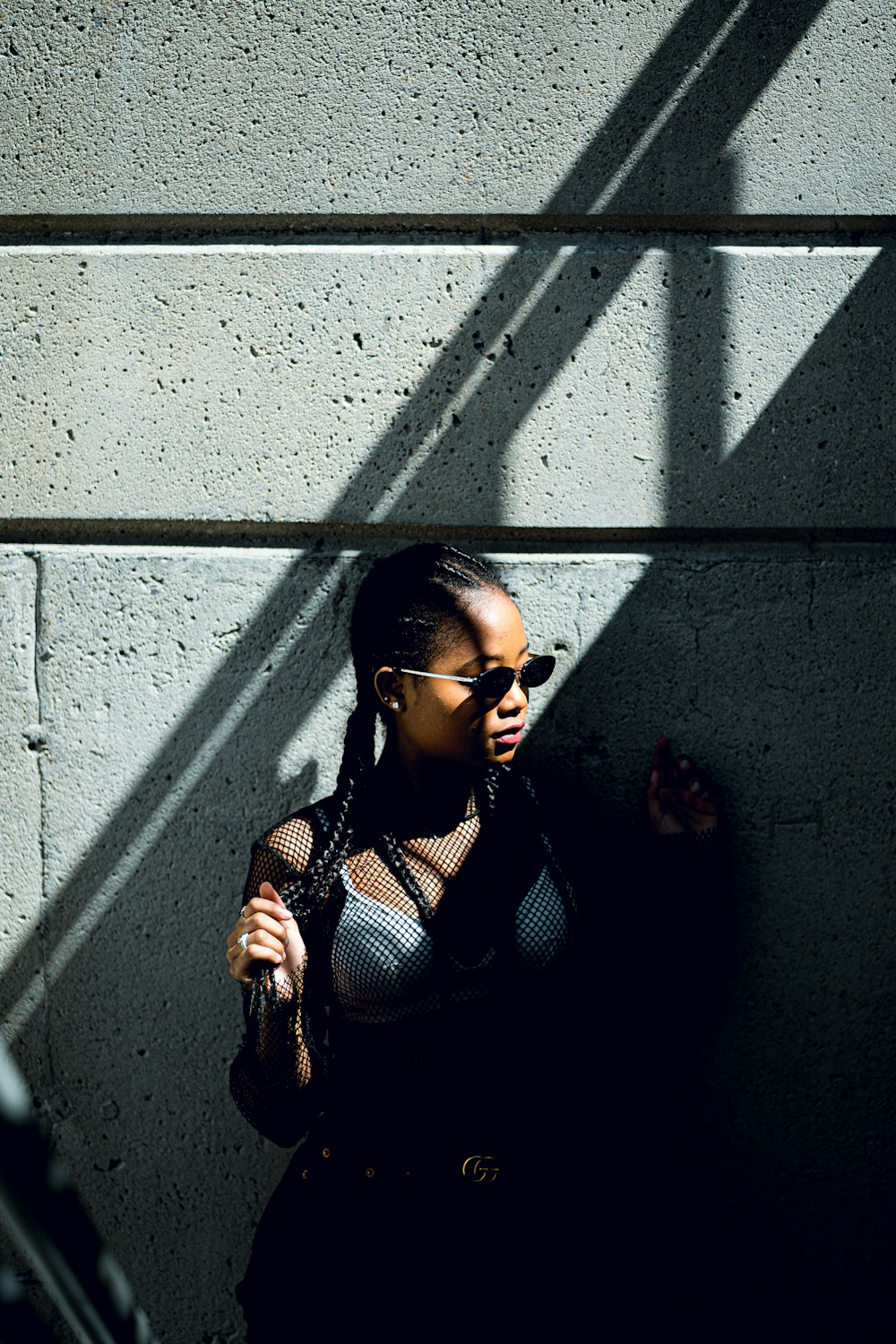 woman in black and white polka dot shirt wearing black sunglasses