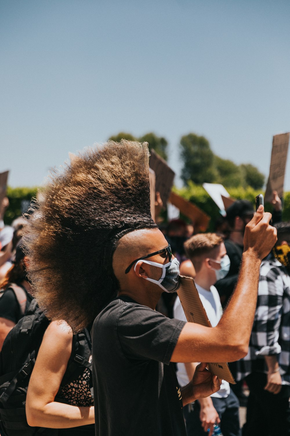 woman in black shirt wearing black sunglasses