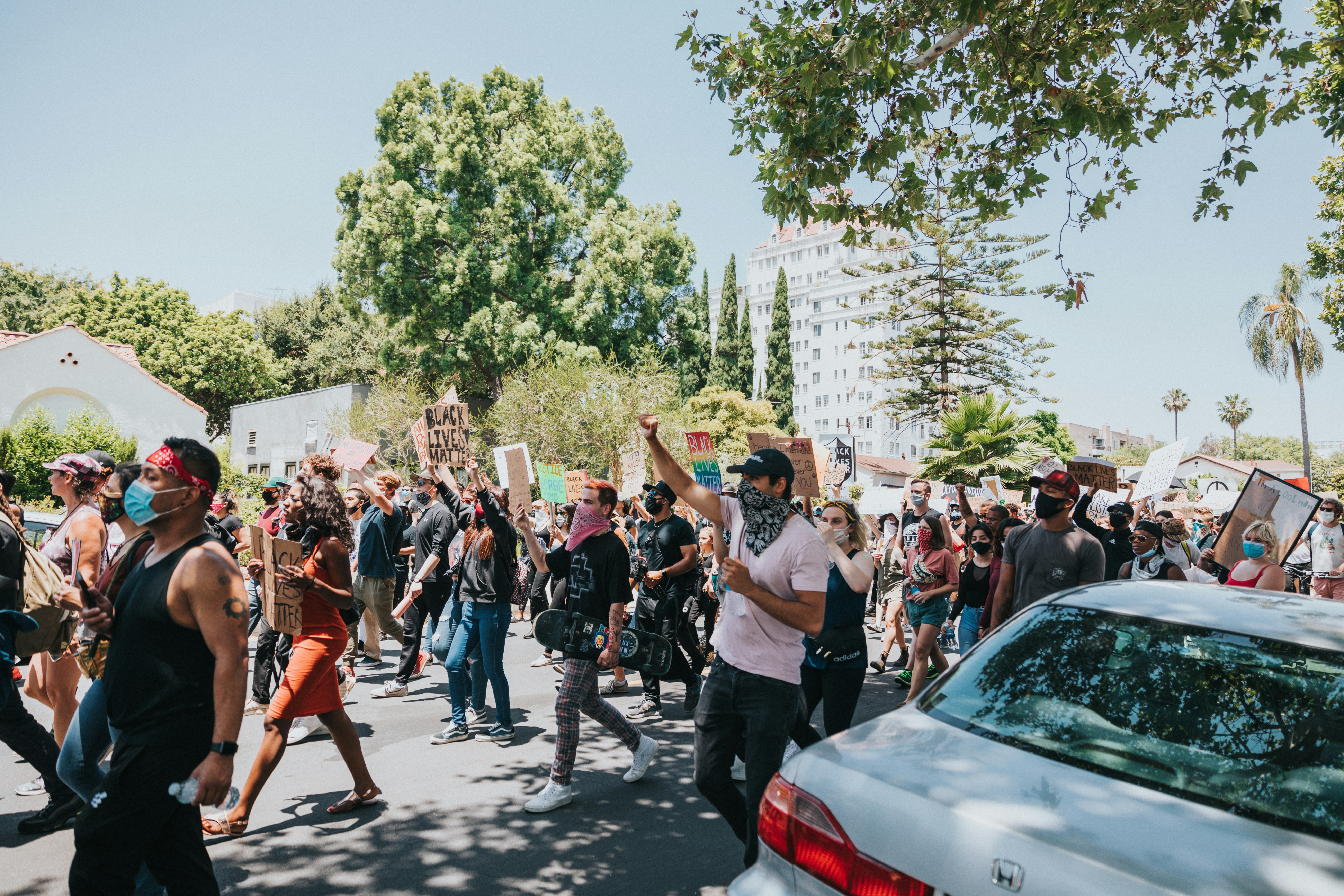 people standing on road during daytime, 
