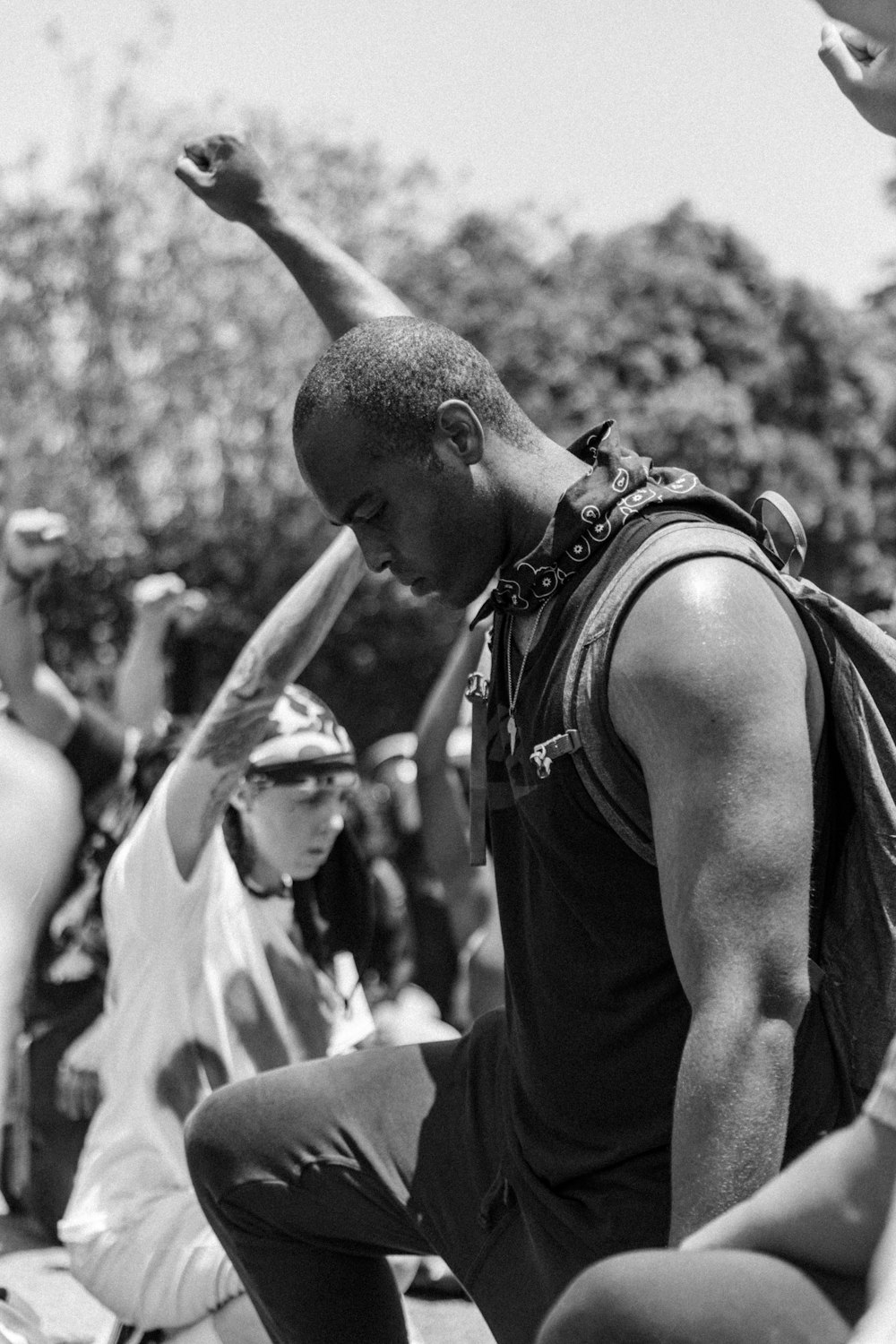 grayscale photo of man in black tank top