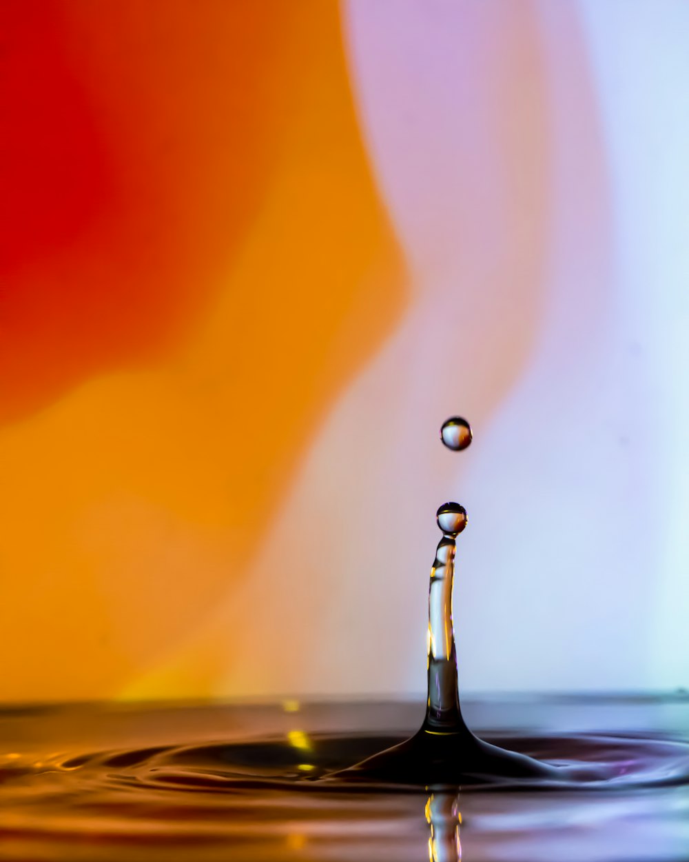 water drop in black ceramic vase