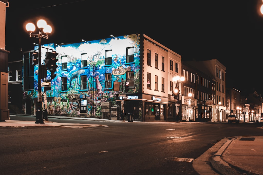 brown concrete building with lights turned on during night time