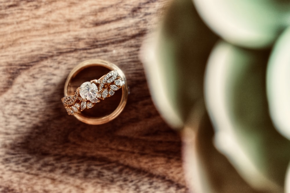 gold ring on brown textile