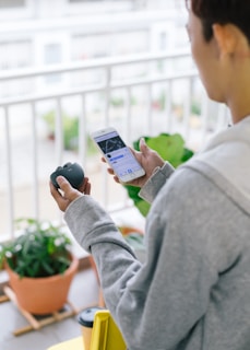Resident using a smartphone app to control access at the building entrance.
