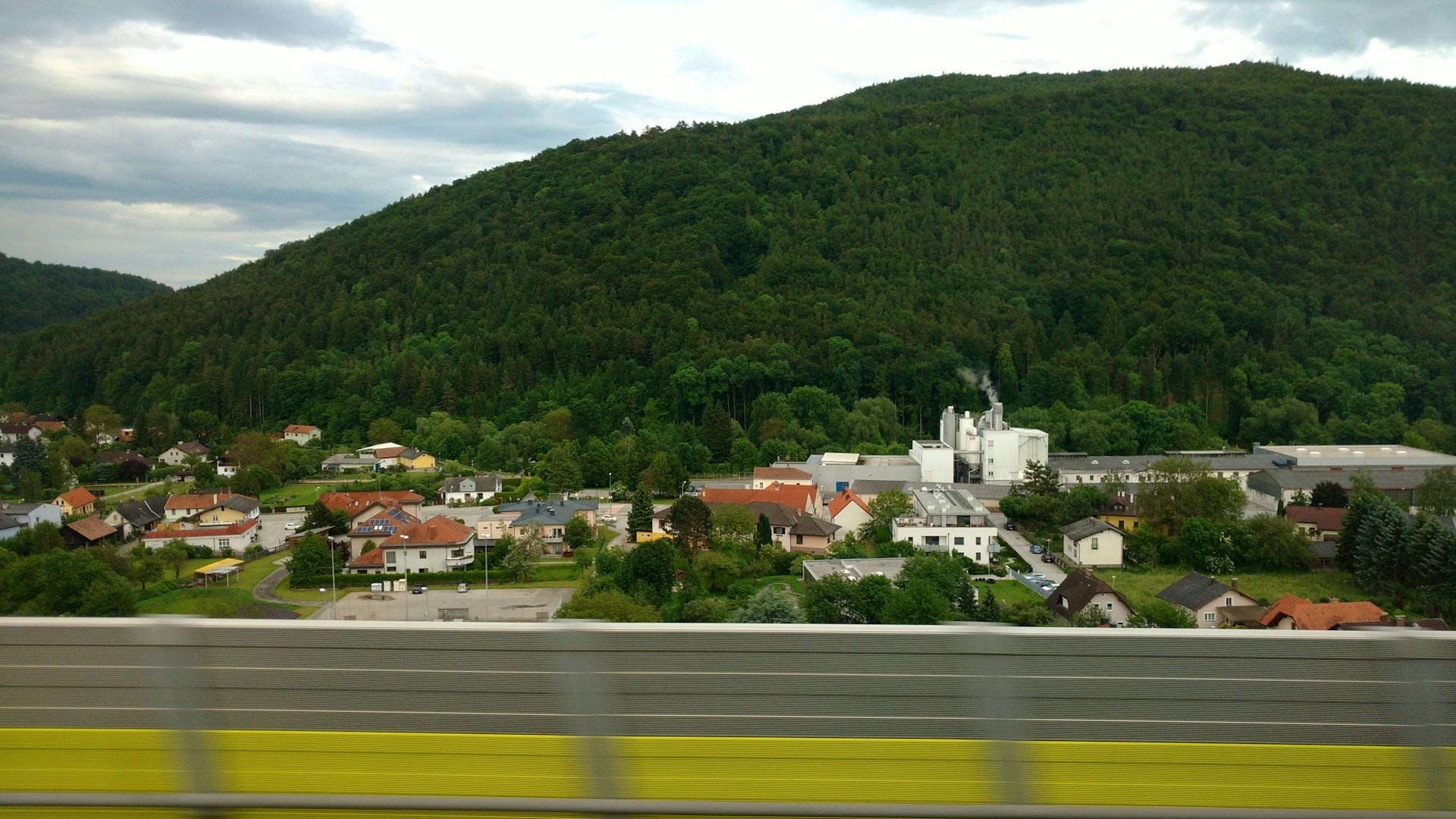 woman wearing yellow long-sleeved dress under white clouds and blue sky during daytime